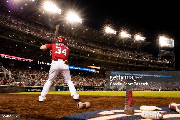 Bryce Harper of the Washington Nationals looks on from the batters circle against the Miami Marlins during the sixth inning at Nationals Park on July...