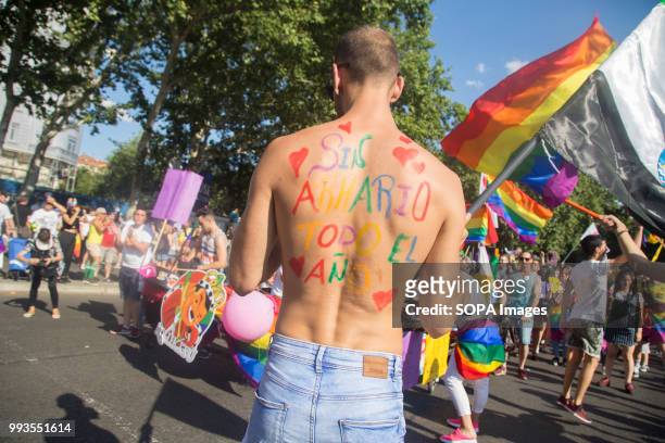 Participant seen having written "No closet all year" on his back. Thousands of people have participated the Gay Pride 2018 in Madrid to against LGBT...