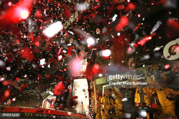 Erik Jones, driver of the buyatoyota.com Toyota, celebrates in Victory Lane after winning the Monster Energy NASCAR Cup Series Coke Zero Sugar 400 at...
