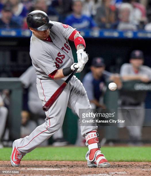 The Boston Red Sox's Christian Vazquez lines up a two-run single in the seventh inning against the Kansas City Royals at Kauffman Stadium in Kansas...