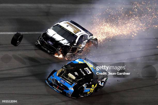 Aric Almirola, driver of the Smithfield Ford, and Michael McDowell, driver of the K-LOVE Radio Ford, are involved in a on-track incident during the...