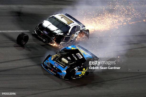 Aric Almirola, driver of the Smithfield Ford, and Michael McDowell, driver of the K-LOVE Radio Ford, are involved in a on-track incident during the...