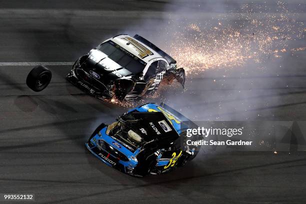 Aric Almirola, driver of the Smithfield Ford, and Michael McDowell, driver of the K-LOVE Radio Ford, are involved in a on-track incident during the...