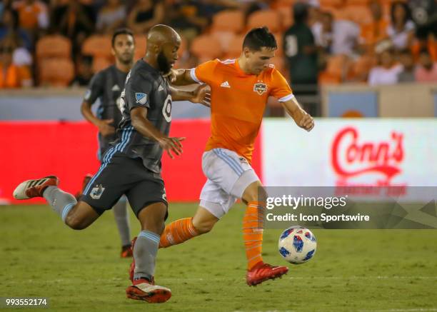 Minnesota United midfielder Collen Warner chases Houston Dynamo midfielder Tomas Martinez during the soccer match between the Minnesota United FC and...