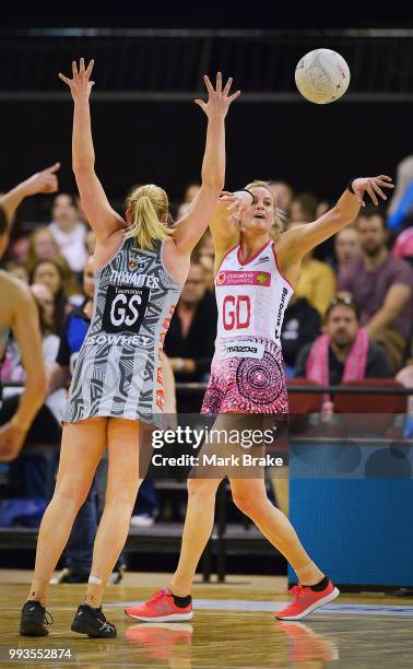 Leana de Bruin of the Thunderbirds passes past Caitlin Thwaites of the Magpies during the round 10 Super Netball match between the Thunderbirds and...