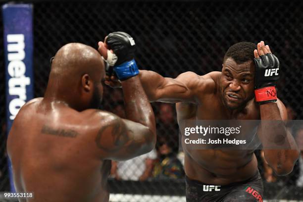 Francis Ngannou of Cameroon punches Derrick Lewis in their heavyweight fight during the UFC 226 event inside T-Mobile Arena on July 7, 2018 in Las...