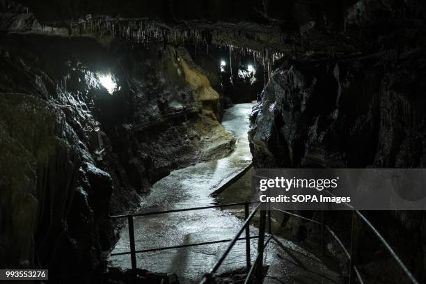 Walk way inside the cave. Ingleborough Cave is a beautiful cave close to the village of Clapham in North Yorkshire, England adjacent to where the...