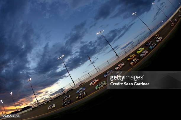 Brad Keselowski, driver of the Stars Stripes and Lites Ford, leads a pack of cars during the Monster Energy NASCAR Cup Series Coke Zero Sugar 400 at...