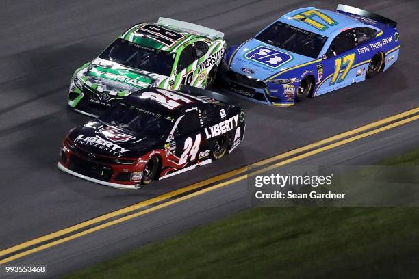 William Byron, driver of the Liberty University Chevrolet, Kyle Busch, driver of the Interstate Batteries Toyota, and Ricky Stenhouse Jr., driver of...