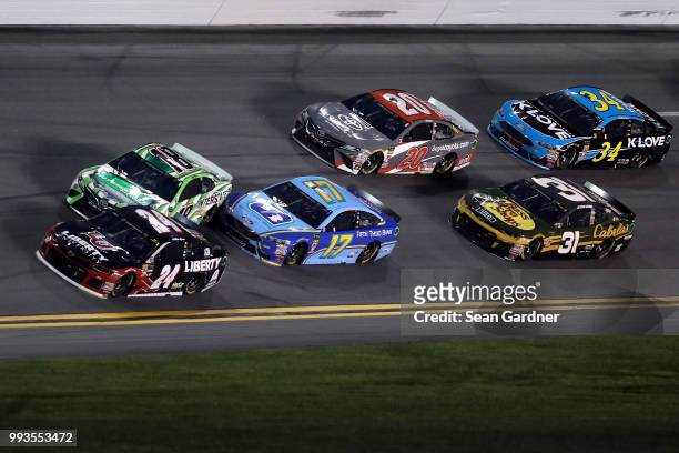 William Byron, driver of the Liberty University Chevrolet, Kyle Busch, driver of the Interstate Batteries Toyota, and Ricky Stenhouse Jr., driver of...