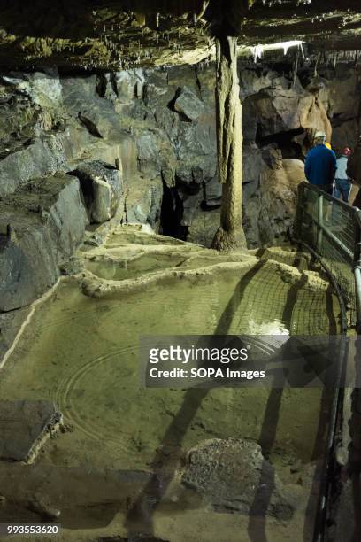 Walk way seen inside the cave. Ingleborough Cave is a beautiful cave close to the village of Clapham in North Yorkshire, England adjacent to where...