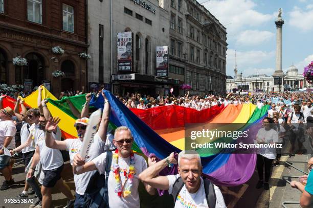 Flagbearers carry a rainbow flag during Pride in London parade. The annual festival attracts hundreds of thousands of people to the streets of the...