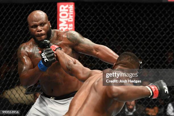 Francis Ngannou of Cameroon punches Derrick Lewis in their heavyweight fight during the UFC 226 event inside T-Mobile Arena on July 7, 2018 in Las...