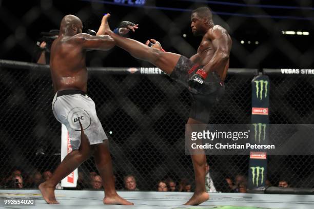 Francis Ngannou of Cameroon kicks Derrick Lewis in their heavyweight fight during the UFC 226 event inside T-Mobile Arena on July 7, 2018 in Las...