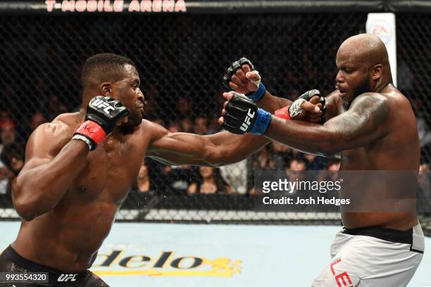 Francis Ngannou of Cameroon punches Derrick Lewis in their heavyweight fight during the UFC 226 event inside T-Mobile Arena on July 7, 2018 in Las...