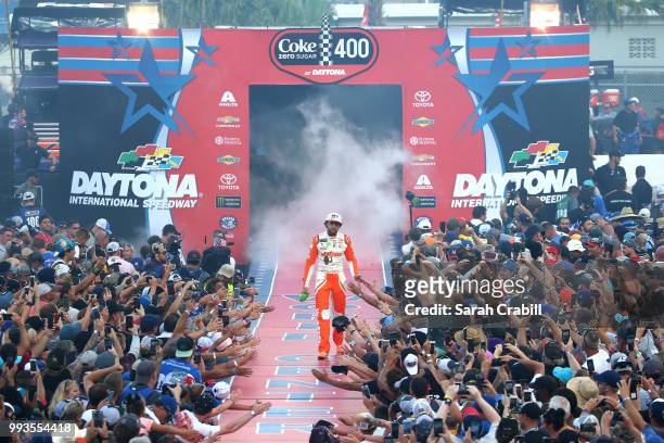 Chase Elliott, driver of the Hooters Chevrolet, participates in pre-race activities before the Monster Energy NASCAR Cup Series Coke Zero Sugar 400...