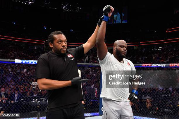 Derrick Lewis raises his hand in a decision over Francis Ngannou of Cameroon in their heavyweight fight during the UFC 226 event inside T-Mobile...