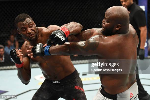 Francis Ngannou of Cameroon punches Derrick Lewis in their heavyweight fight during the UFC 226 event inside T-Mobile Arena on July 7, 2018 in Las...