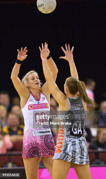 Leana de Bruin of the Thunderbirds passes over Alice Teague-Neeld of the Magpies during the round 10 Super Netball match between the Thunderbirds and...