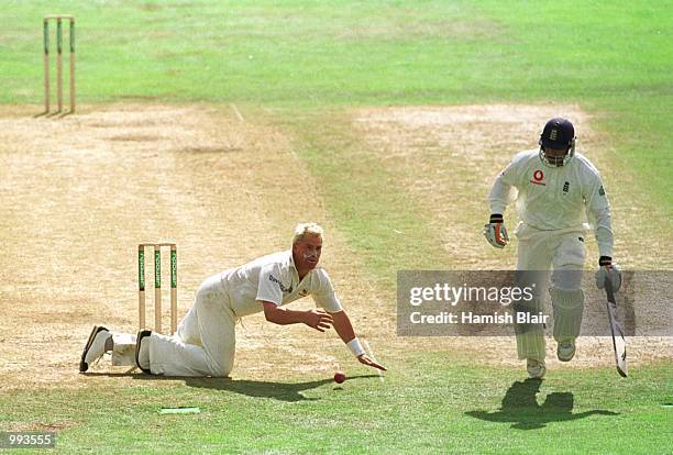 Shane Warne of Australia dives to stop a shot from Mark Butcher of England during the fifth day of the England v Australia fourth NPower test match...