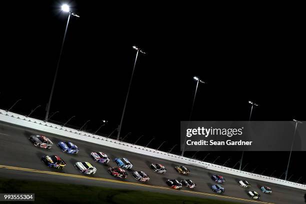 Cars race during the Monster Energy NASCAR Cup Series Coke Zero Sugar 400 at Daytona International Speedway on July 7, 2018 in Daytona Beach, Florida.