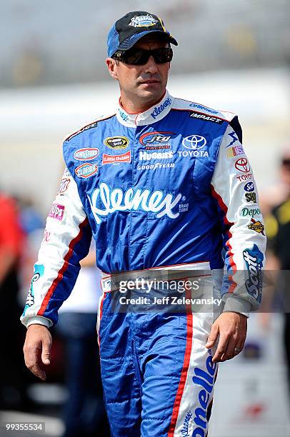 Marcos Ambrose, driver of the A&P/MDA Toyota, walks on the grid during qualifying for the NASCAR Sprint Cup Series Autism Speaks 400 at Dover...