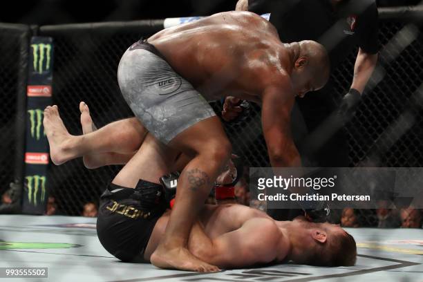 Daniel Cormier punches Stipe Miocic in their UFC heavyweight championship fight during the UFC 226 event inside T-Mobile Arena on July 7, 2018 in Las...