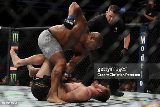 Daniel Cormier punches Stipe Miocic in their UFC heavyweight championship fight during the UFC 226 event inside T-Mobile Arena on July 7, 2018 in Las...