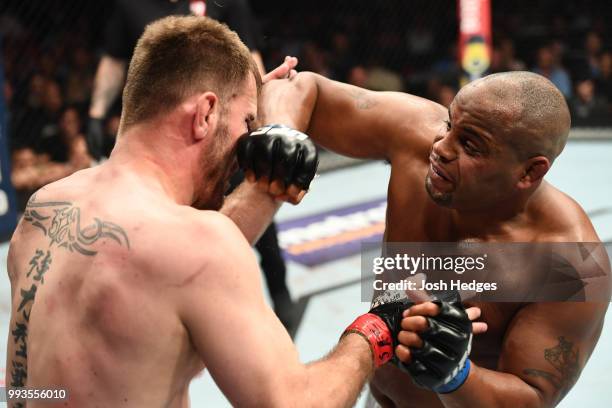 Daniel Cormier punches Stipe Miocic in their UFC heavyweight championship fight during the UFC 226 event inside T-Mobile Arena on July 7, 2018 in Las...