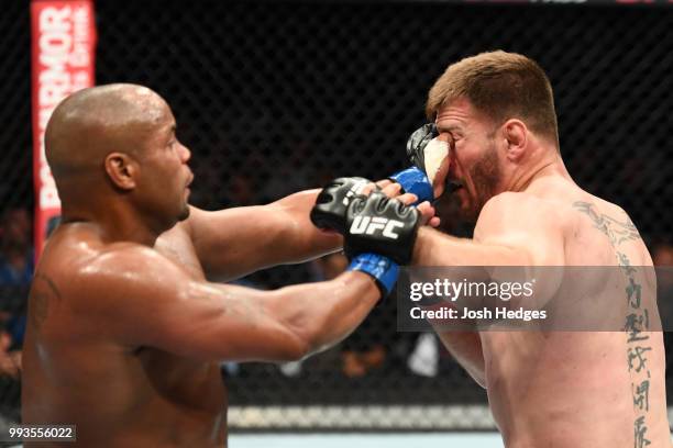 Daniel Cormier punches Stipe Miocic in their UFC heavyweight championship fight during the UFC 226 event inside T-Mobile Arena on July 7, 2018 in Las...