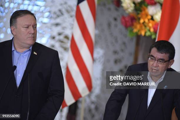 Secretary of State Mike Pompeo listens to Japan's Foreign Minister Taro Kono during a press conference with South Korea's Foreign Minister Kang...