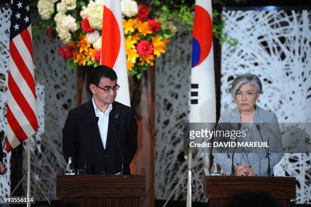 Japan's Foreign Minister Taro Kono and South Korea's Foreign Minister Kang Kyung-wha attend a press conference with US Secretary of State Mike Pompeo...