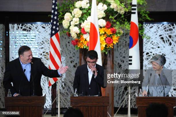 Mike Pompeo, U.S. Secretary of state, left, gestures towards Taro Kono, Japan's foreign minister, center, and Kang Kyung-Wha, South Korea's foreign...