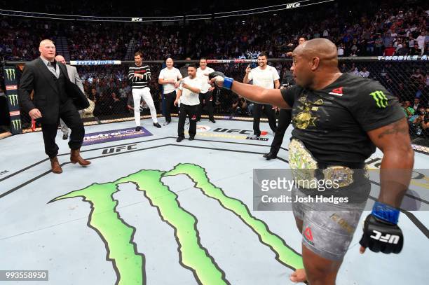 Daniel Cormier confronts Brock Lesnar in the Octagon after his UFC heavyweight championship fight during the UFC 226 event inside T-Mobile Arena on...