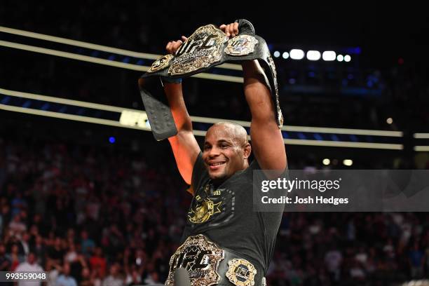 Daniel Cormier celebrates his victory over Stipe Miocic in their UFC heavyweight championship fight during the UFC 226 event inside T-Mobile Arena on...