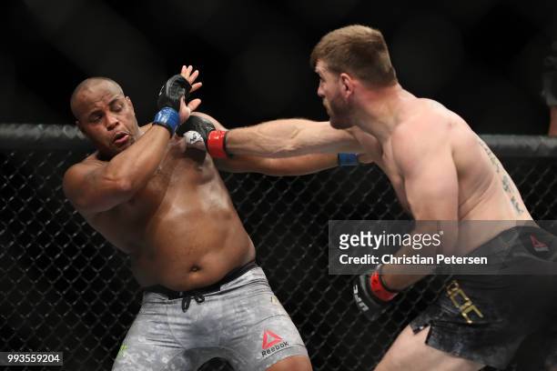 Stipe Miocic punches Daniel Cormier in their UFC heavyweight championship fight during the UFC 226 event inside T-Mobile Arena on July 7, 2018 in Las...