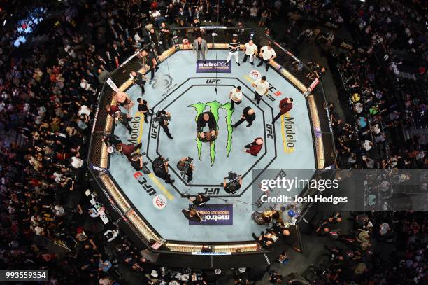 An overhead view as Brock Lesnar confronts Daniel Cormier after his UFC heavyweight championship fight during the UFC 226 event inside T-Mobile Arena...