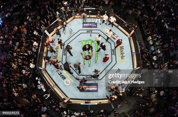 An overhead view as Brock Lesnar confronts Daniel Cormier after his UFC heavyweight championship fight during the UFC 226 event inside T-Mobile Arena...