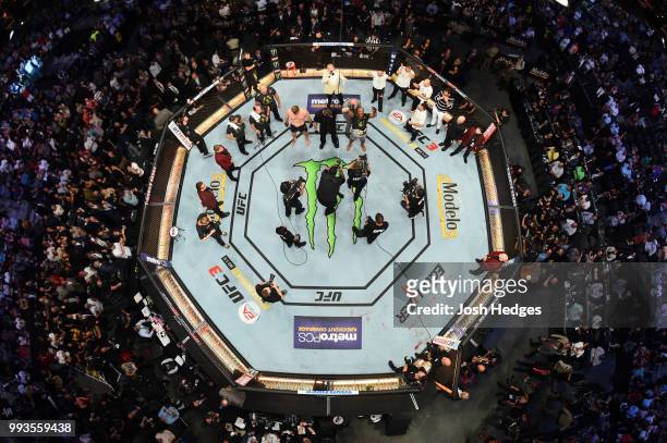 An overhead view as Daniel Cormier celebrates his victory over Stipe Miocic in their UFC heavyweight championship fight during the UFC 226 event...