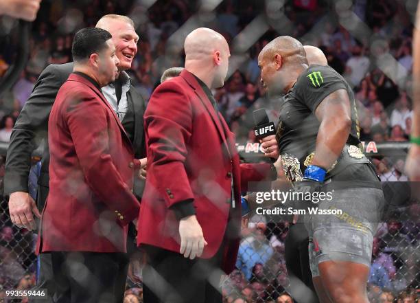 Daniel Cormier addresses with Brock Lesnar after winning his heavyweight championship fight against Stipe Miocic at T-Mobile Arena on July 7, 2018 in...