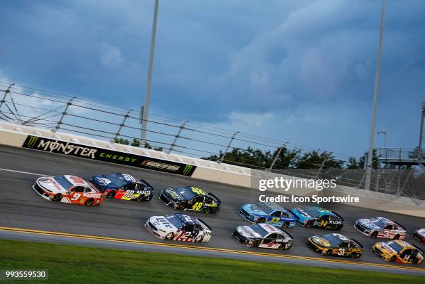 Chase Elliott, driver of the Hooters Chevrolet, leads the field during the Coke Zero Sugar 400 on July 7, 2018 at Daytona International Speedway in...