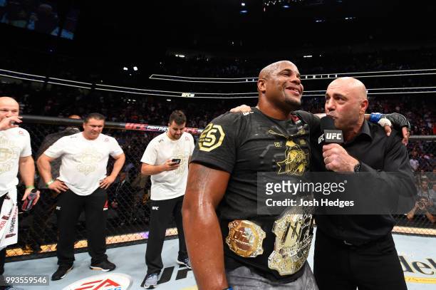 Daniel Cormier talks to Joe Rogan after defeating Stipe Miocic in their UFC heavyweight championship fight during the UFC 226 event inside T-Mobile...