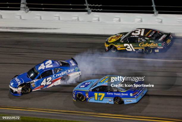 Kyle Larson, driver of the Credit One Bank Chevrolet, spins in front of Ricky Stenhouse Jr., driver of the Fifth Third Bank Ford, during the Coke...