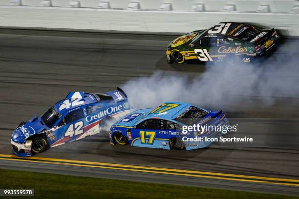 Kyle Larson, driver of the Credit One Bank Chevrolet, spins in front of Ricky Stenhouse Jr., driver of the Fifth Third Bank Ford, during the Coke...