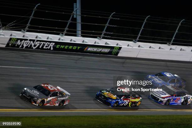 Erik Jones, driver of the buyatoyota.com Toyota, leads the race on the final lap during the Coke Zero Sugar 400 on July 7, 2018 at Daytona...