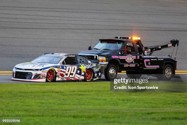 Landon Cassill, driver of the StarCom Fiber Chevrolet, gets a push prior to the start of the Coke Zero Sugar 400 on July 7, 2018 at Daytona...