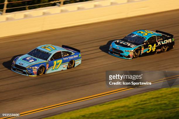 Ricky Stenhouse Jr., driver of the Fifth Third Bank Ford, and Michael McDowell, driver of the K-LOVE Radio Ford, during the Coke Zero Sugar 400 on...