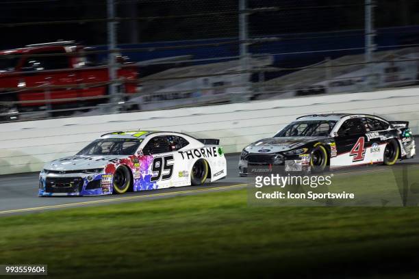 Kasey Kahne, driver of the Thorne Wellness Chevrolet, leads Kevin Harvick, driver of the Jimmy Johns Kickin Ranch Ford, during the Coke Zero Sugar...