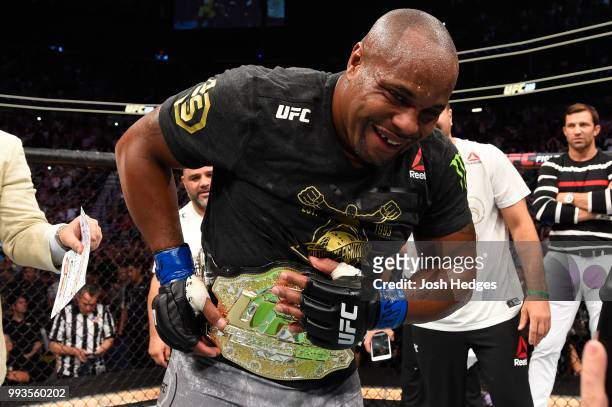 Daniel Cormier celebrates his victory over Stipe Miocic in their UFC heavyweight championship fight during the UFC 226 event inside T-Mobile Arena on...
