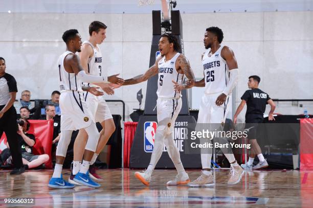 Monte Morris and DeVaughn Akoon Purcell of the Denver Nuggets high five during the game against the Boston Celtics during the 2018 Las Vegas Summer...